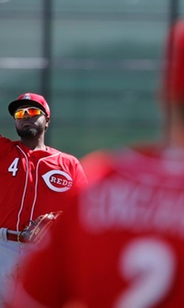 Despite offseason deals, Reds' Phillips back for 11th year